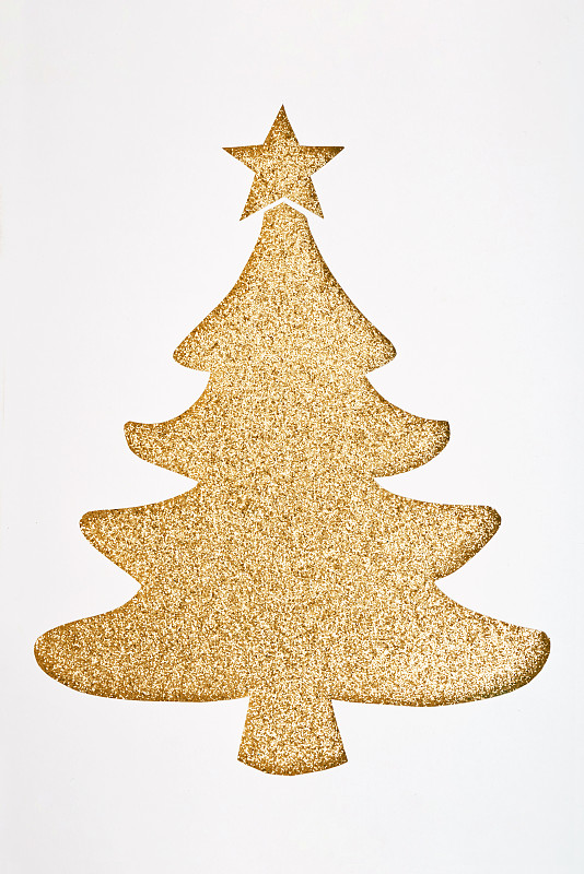 手工圣誕樹剪紙與金色的閃閃發光的背景圖片素材