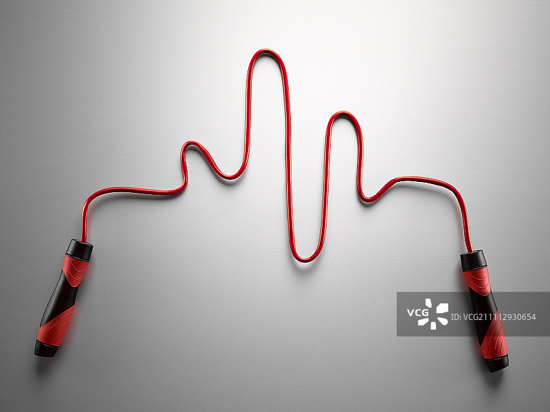 红色跳绳在灰色背景上形成脉冲痕迹图片素材