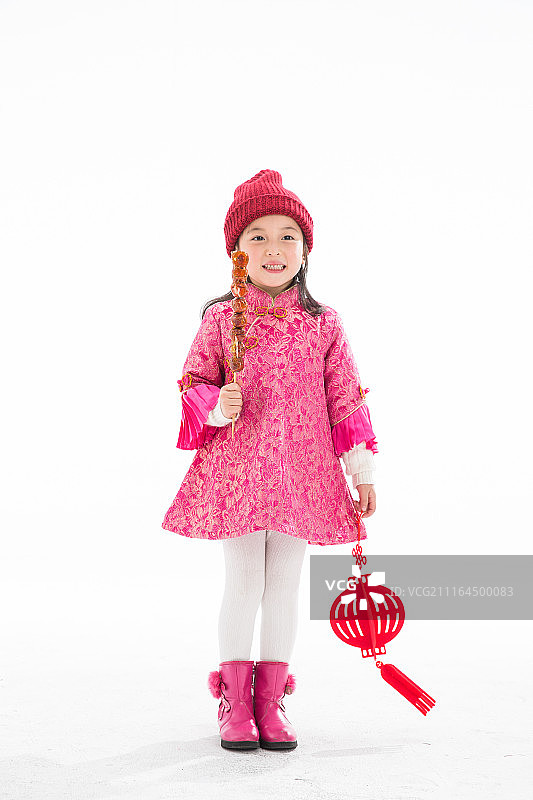 欢乐的小女孩吃糖葫芦图片素材