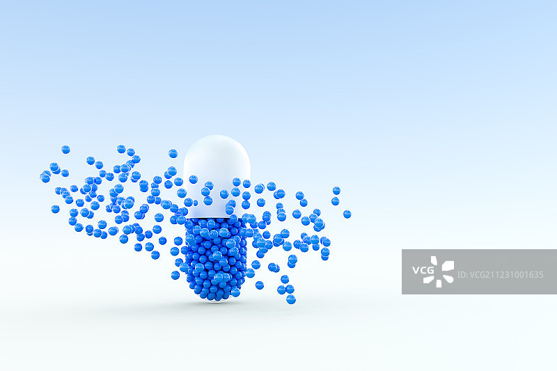 蓝色胶囊与飞散的颗粒，三维渲染图片素材