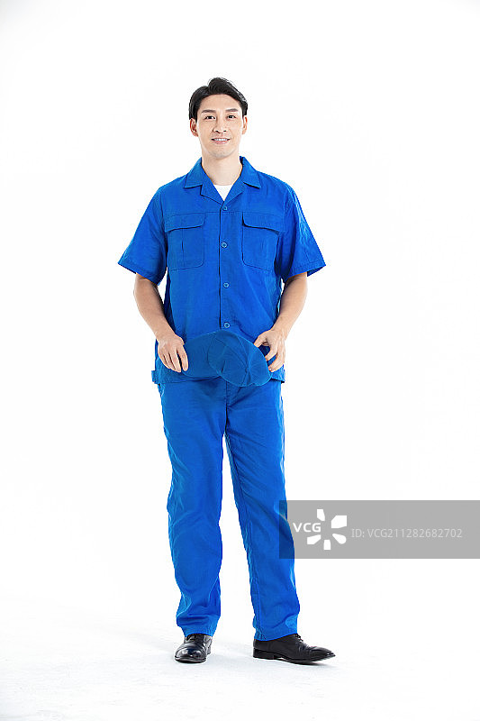 身穿蓝色工装的年轻男性图片素材