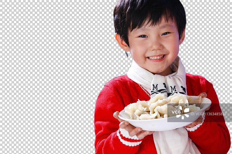 东方儿童过年端饺子图片素材