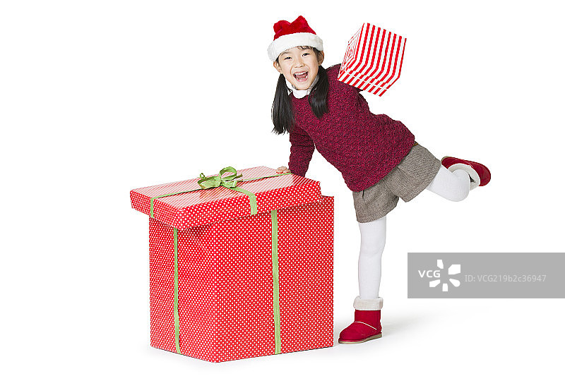 快乐的小女孩和圣诞礼物图片素材