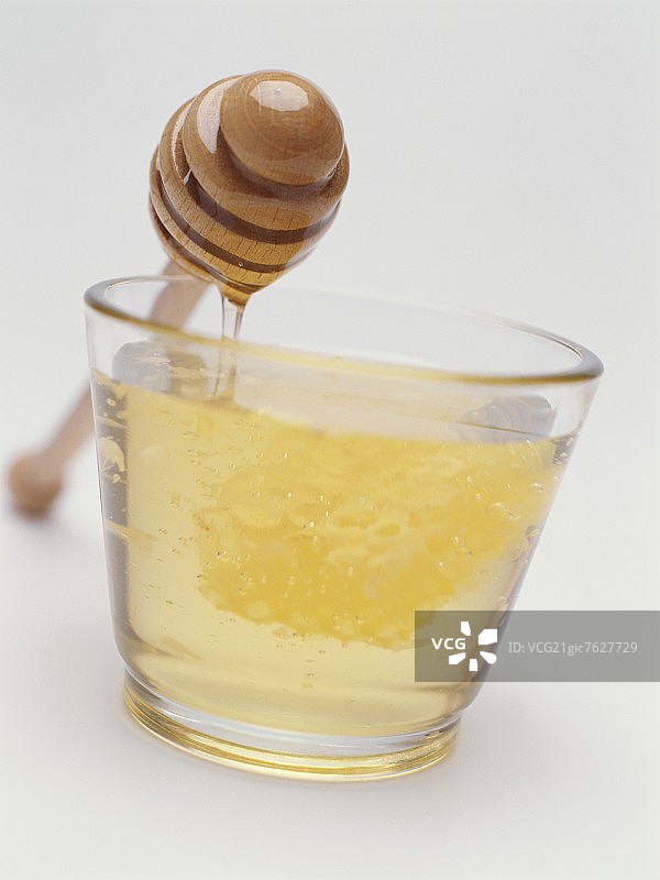 蜂蜜与蜂窝和蜂蜜勺(也有酒香)图片素材