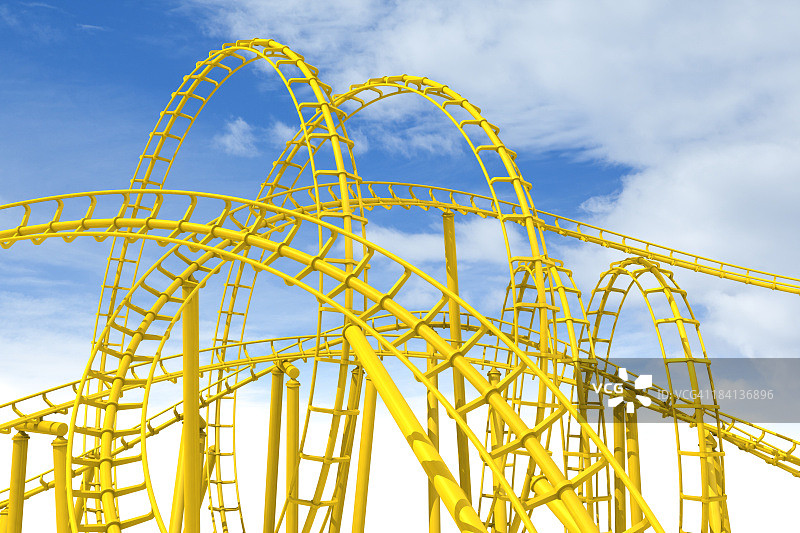 一个令人敬畏的复杂的黄色过山车在蓝天的映衬下图片素材