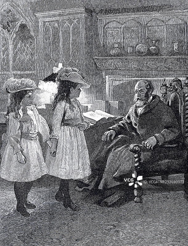 两个女孩和坐在图书馆椅子上的爷爷聊天图片素材