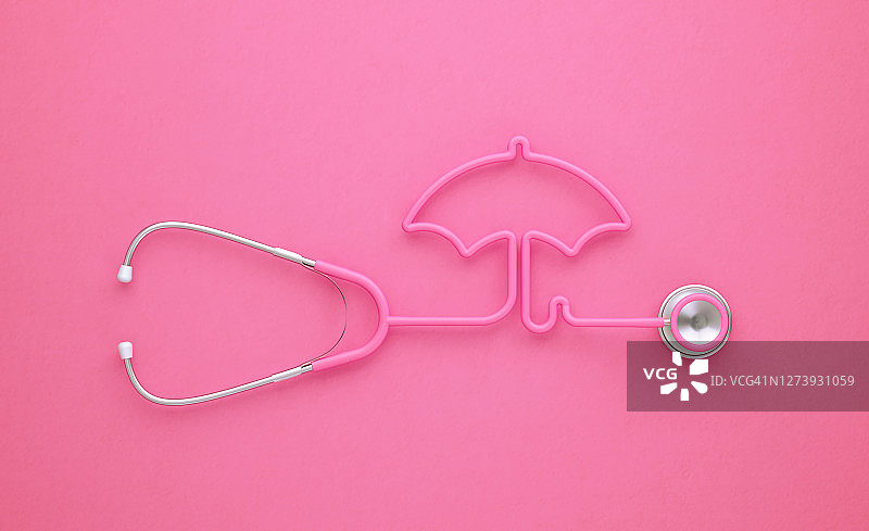 粉红色听诊器在粉红色背景上形成粉红色伞状图片素材