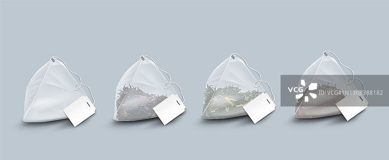 金字塔形状的茶包与叶子和香草图片素材
