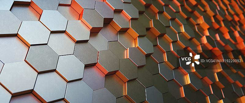 金属灰色和橙色六角形蜂窝结构，特写散焦组成图片素材