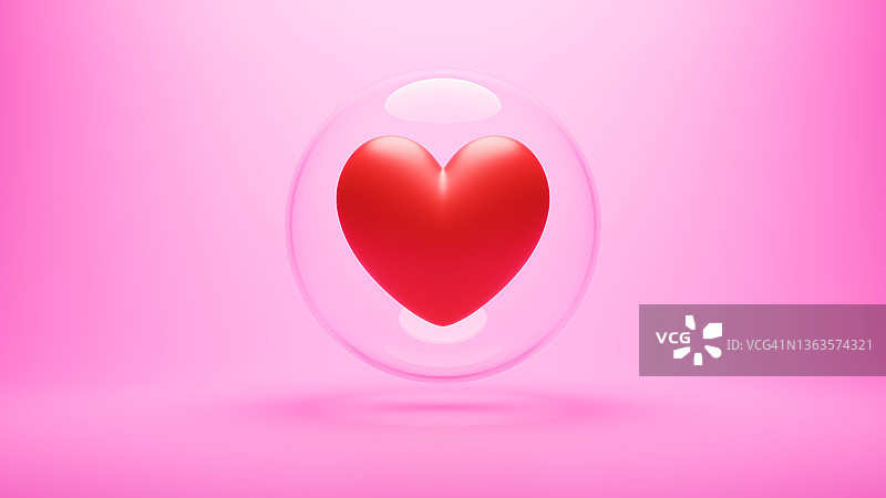 水晶球周围一个红色的心在粉红色的背景。爱隔离、珍重、唯一性的观念。图片素材