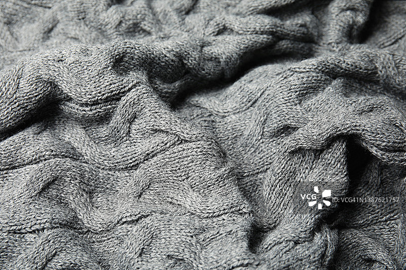 软灰色针织格子作为背景，特写图片素材