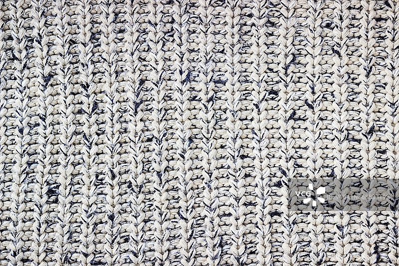 针织的背景。毛线样品用羊毛编织的样品编织模式。图片素材