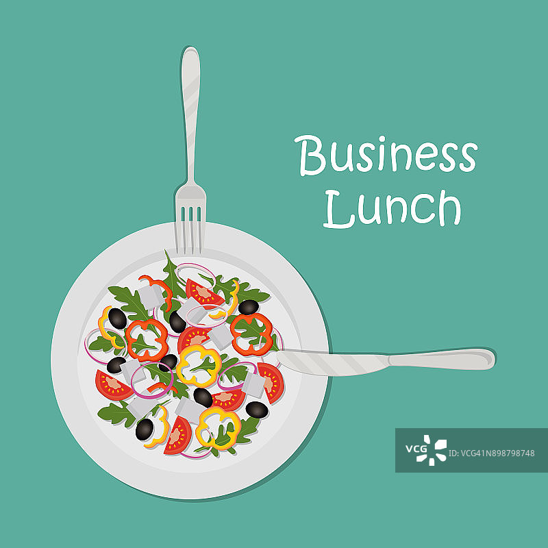 商务午餐的概念。以绿色为背景的沙拉盘图片素材