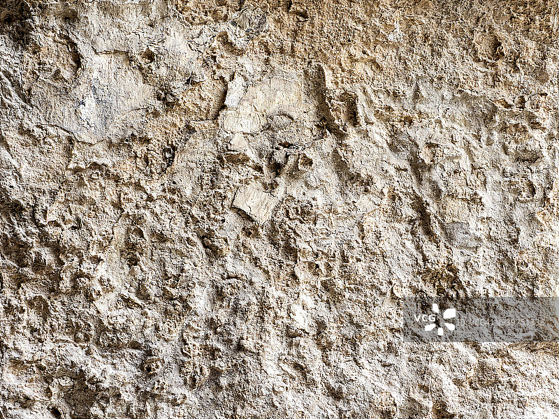 在岩石中挖掘的古城墙的完整框架纹理。高分辨率的照片。图片素材
