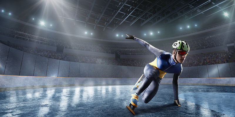 男子短道运动员滑在专业冰场图片素材