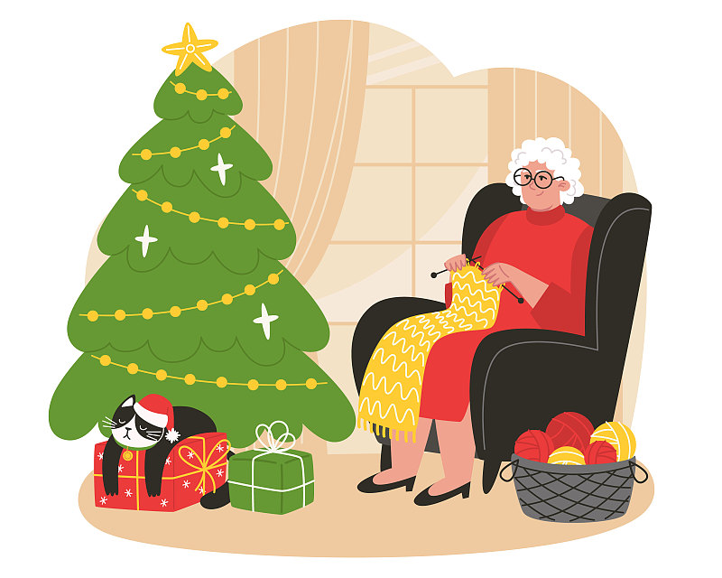 老妇人坐在圣诞树旁的扶手椅上织围巾图片下载