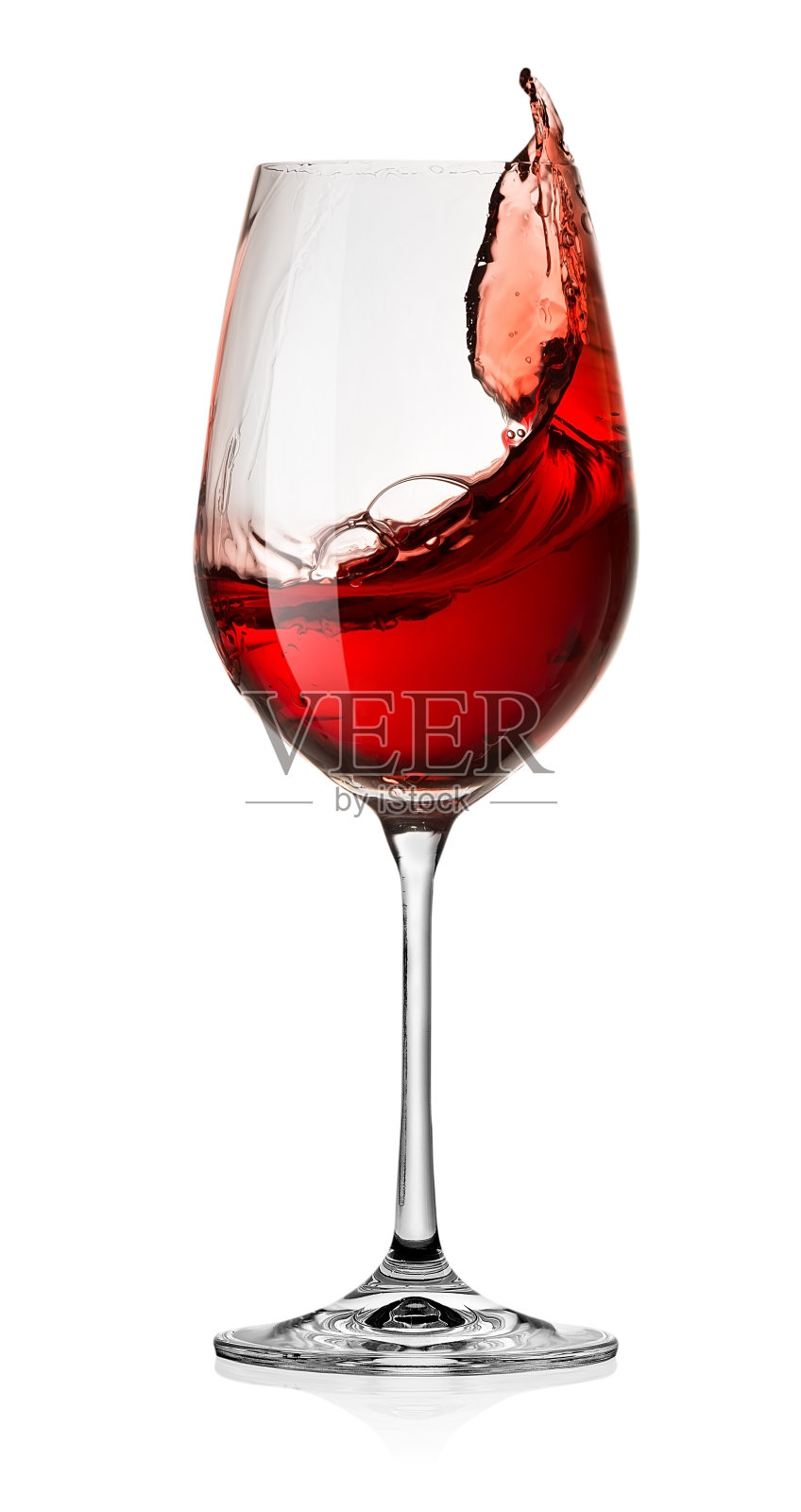 一杯红酒洒在白色的背景上照片摄影图片