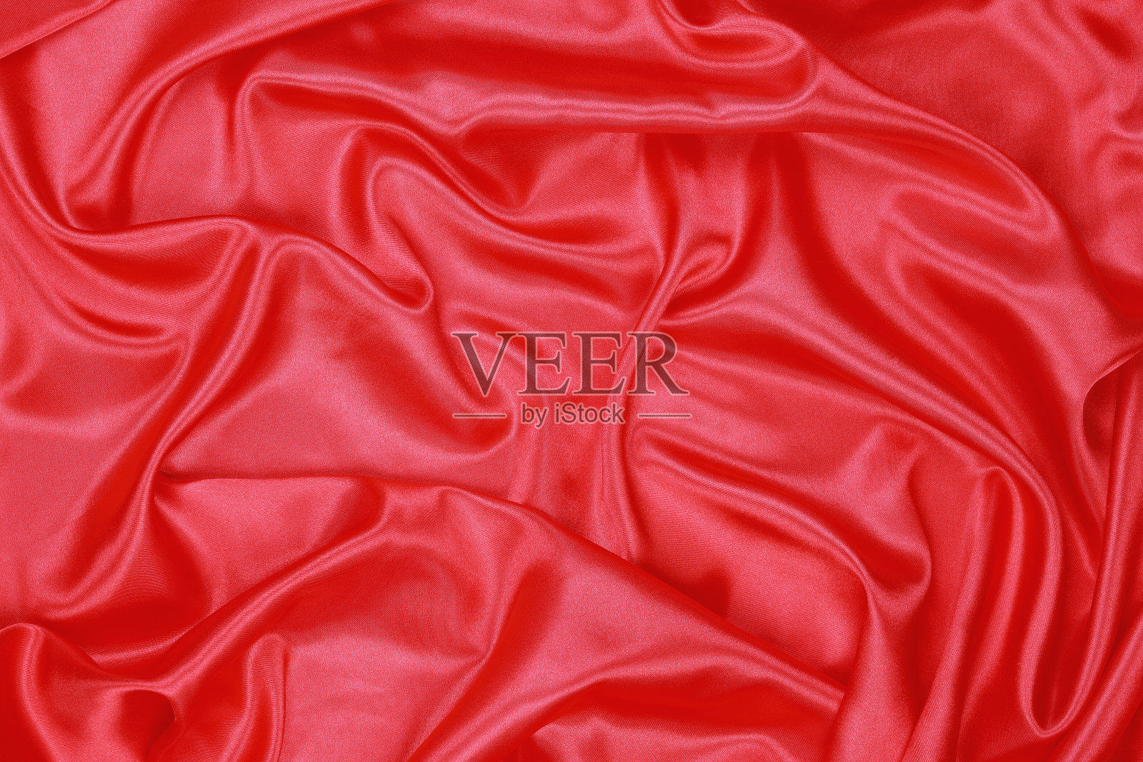红色丝绸的波浪抽象背景照片摄影图片