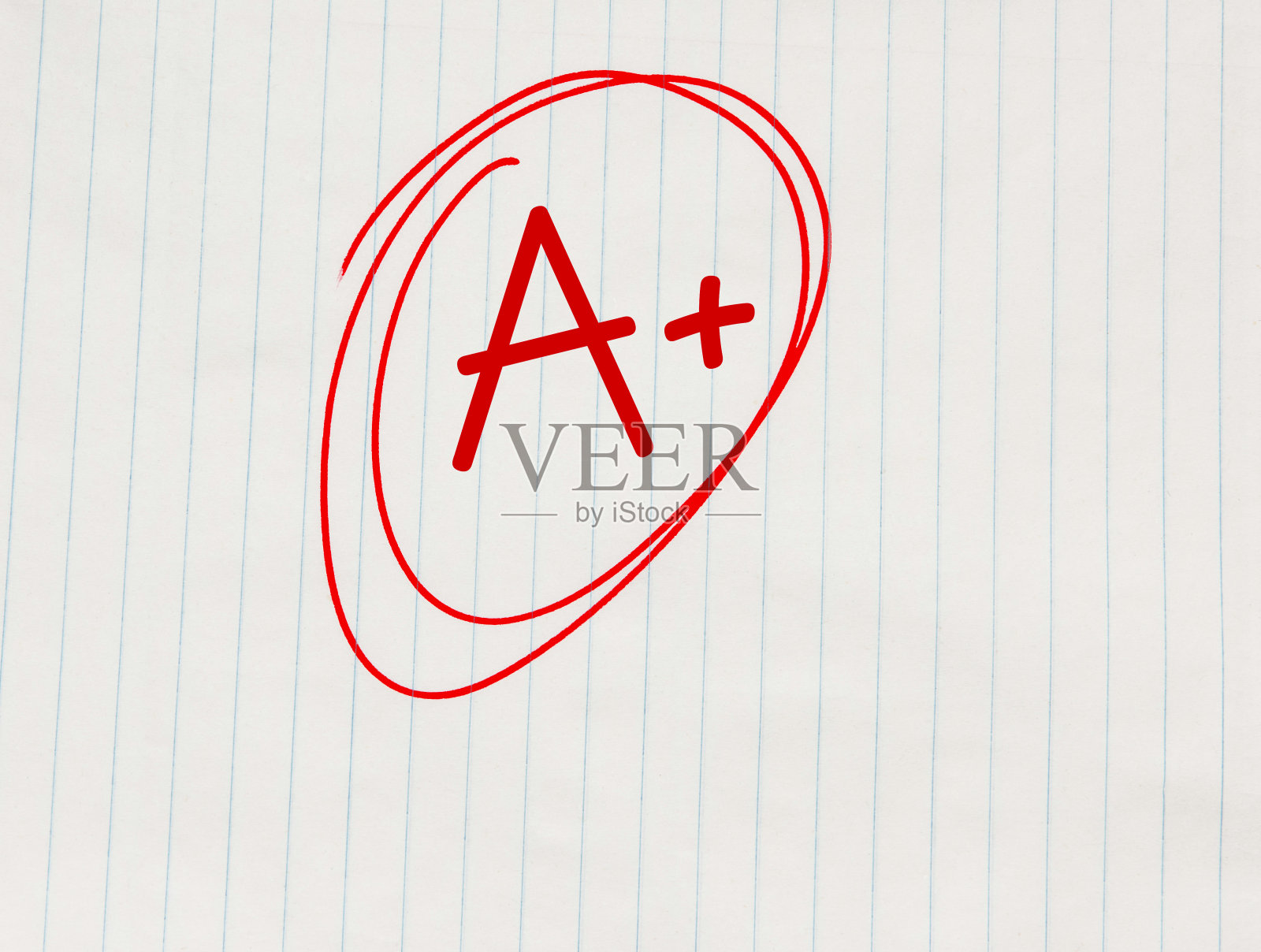 A+ (A+)用红笔写在笔记本纸上照片摄影图片