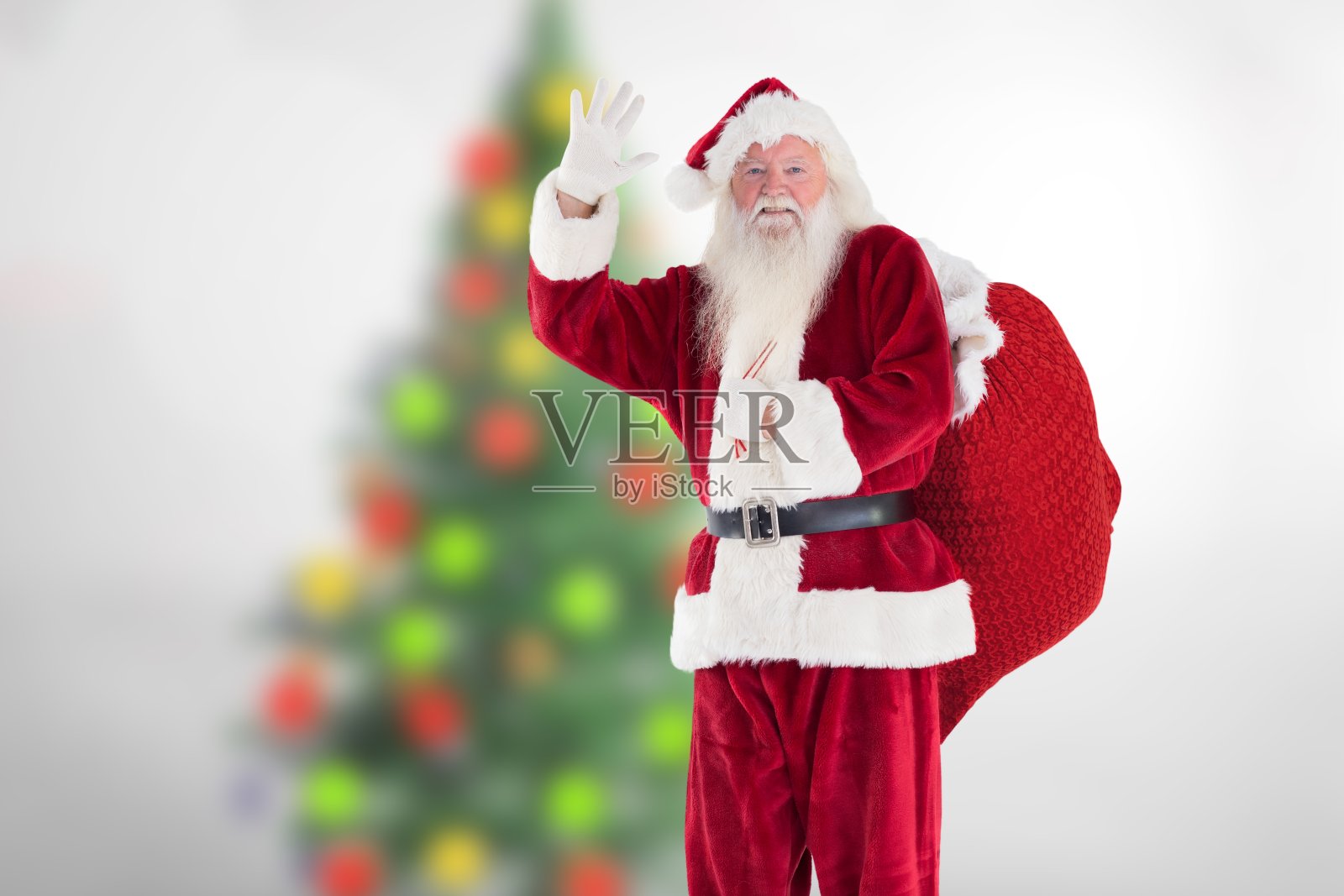 圣诞老人在圣诞节期间挥舞着他的手照片摄影图片
