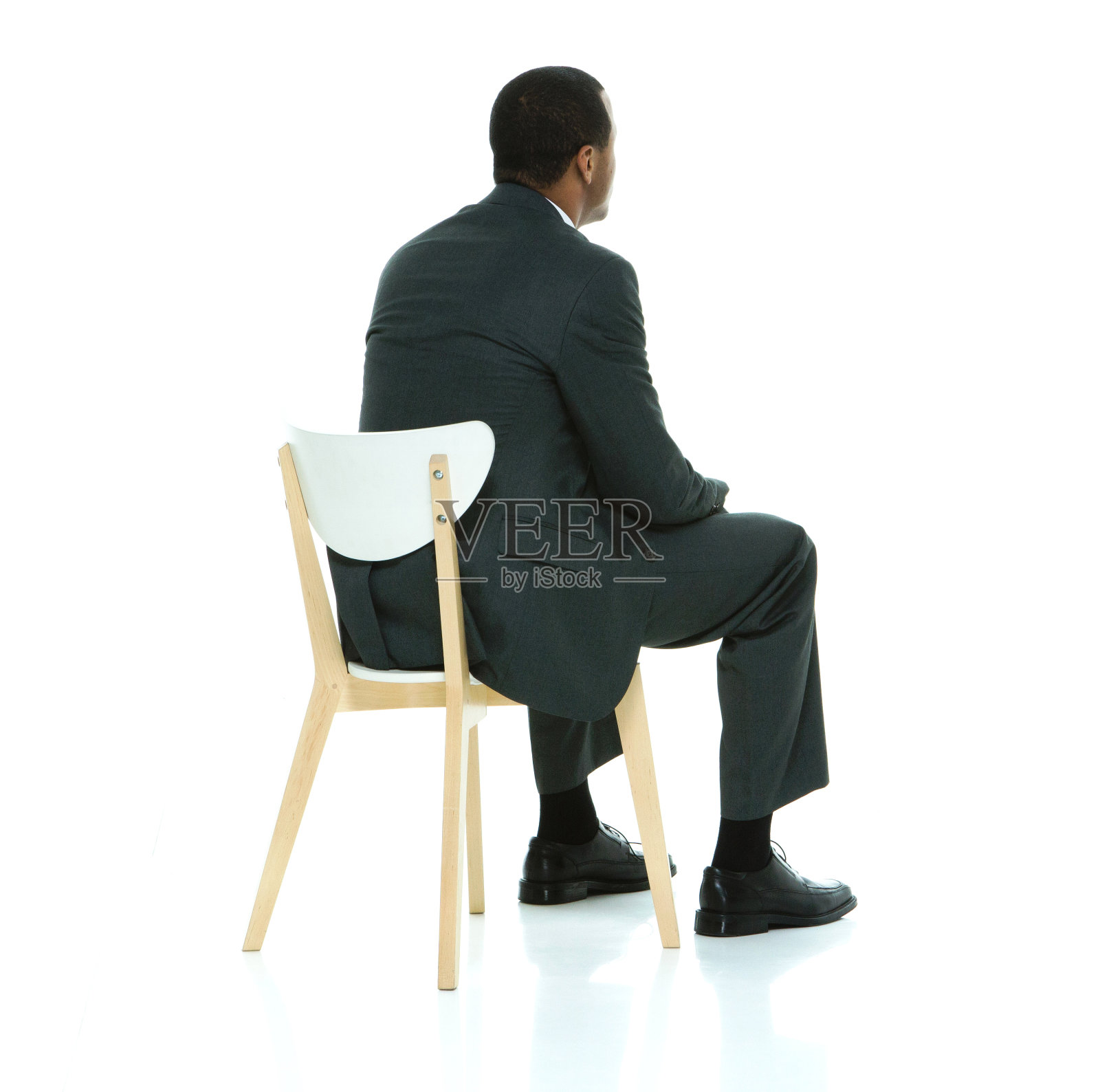 商人坐在椅子上的后视图照片摄影图片
