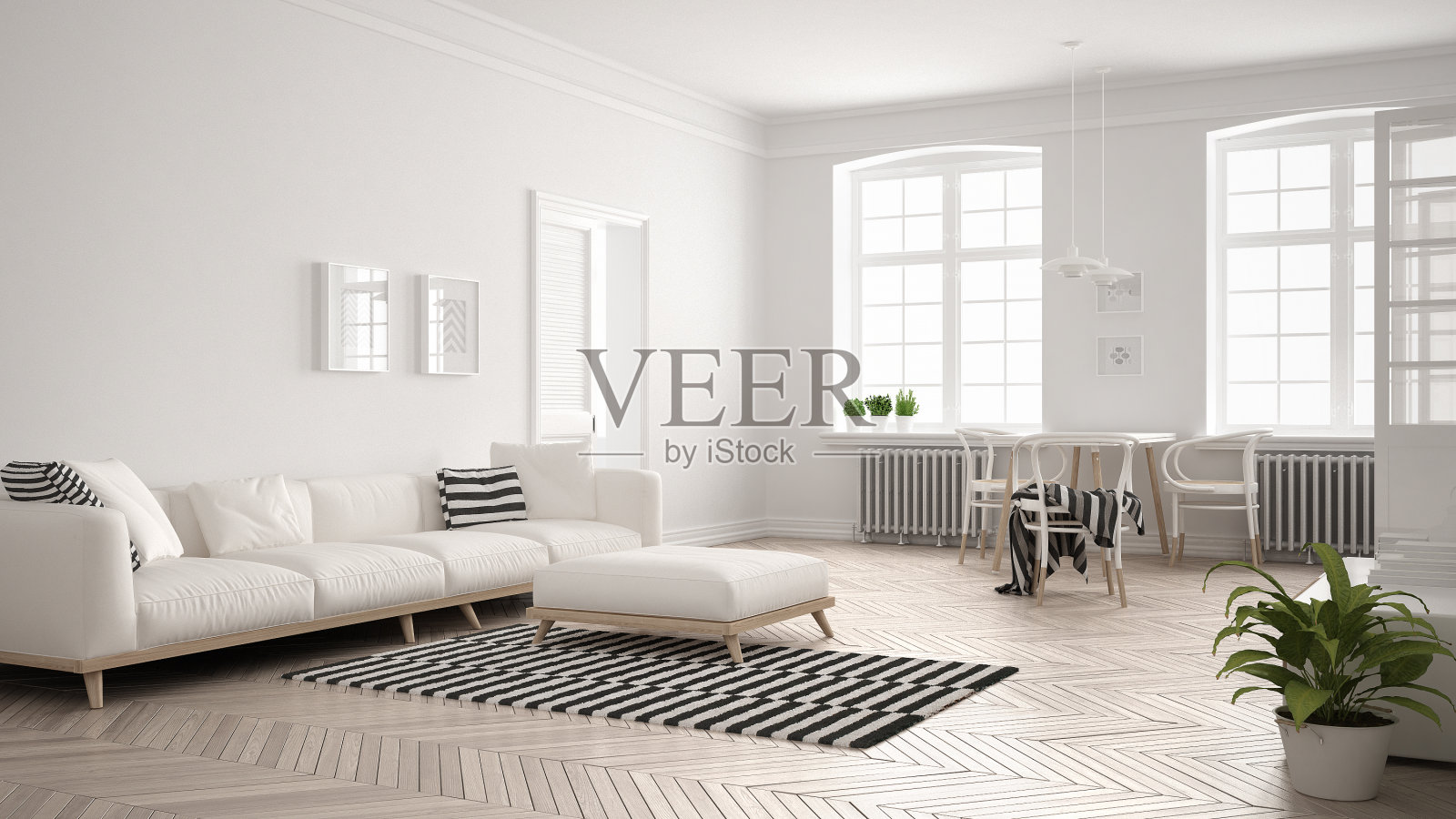 明亮的极简主义客厅配有沙发和餐桌，斯堪的纳维亚白色室内设计照片摄影图片