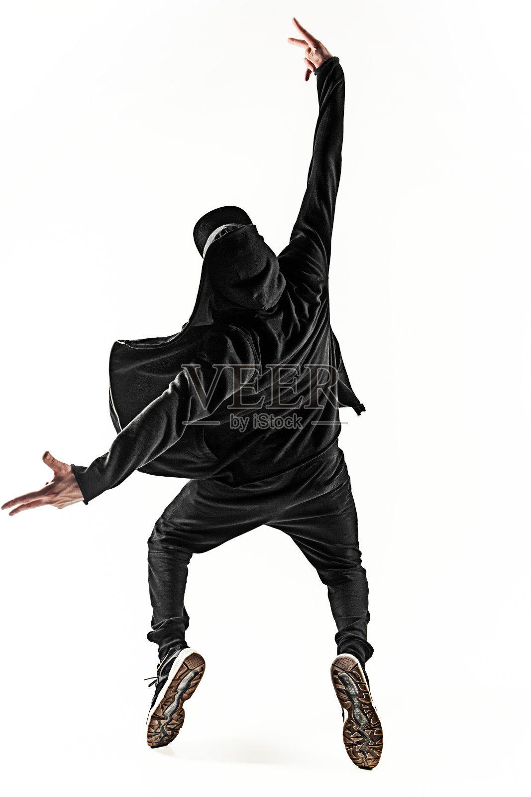 一个嘻哈男霹雳舞舞者的剪影在白色的背景上跳舞照片摄影图片