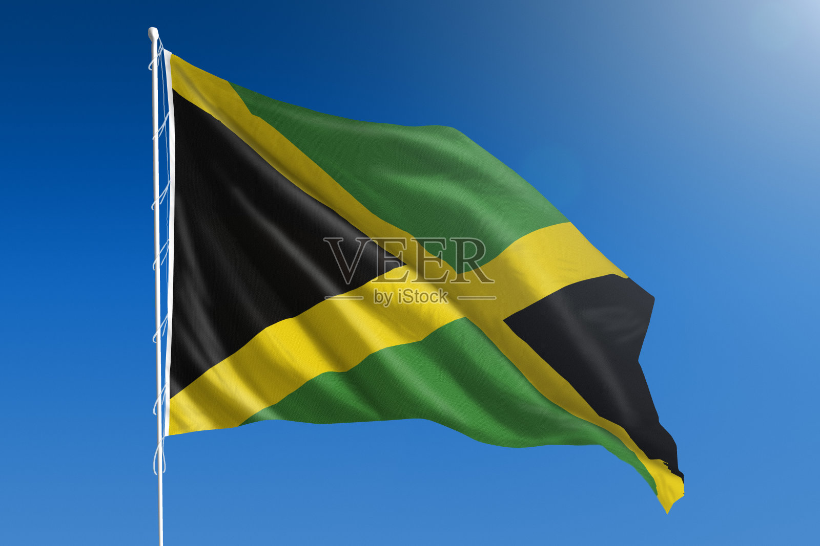 湛蓝的天空上悬挂着牙买加国旗照片摄影图片