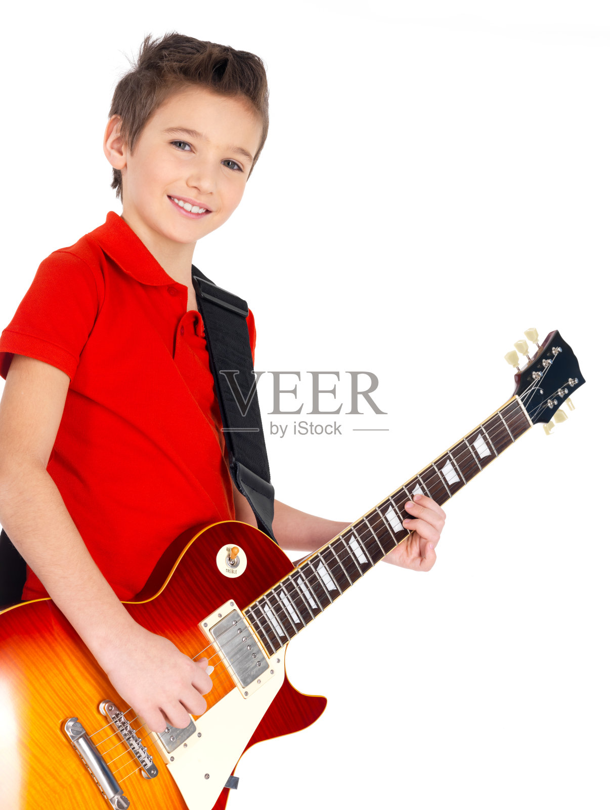 一个小男孩拿着电吉他的肖像照片摄影图片