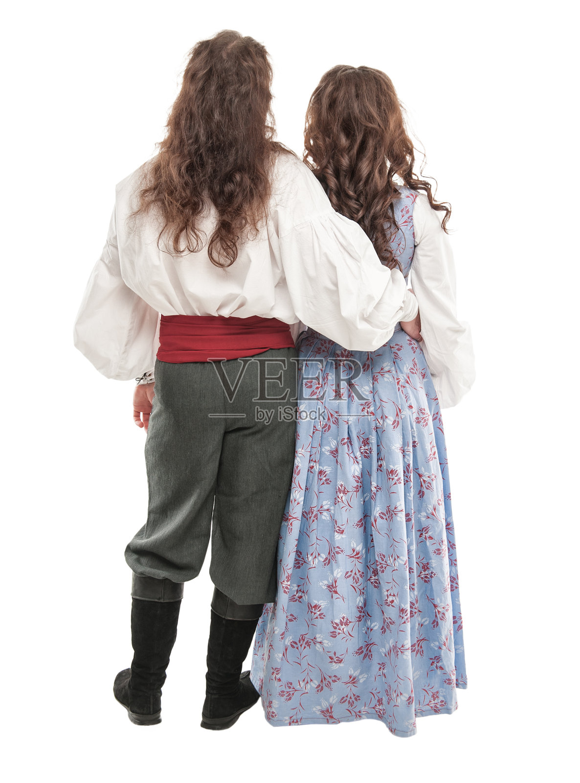 一对穿着中世纪服装的漂亮夫妇。背部姿势照片摄影图片