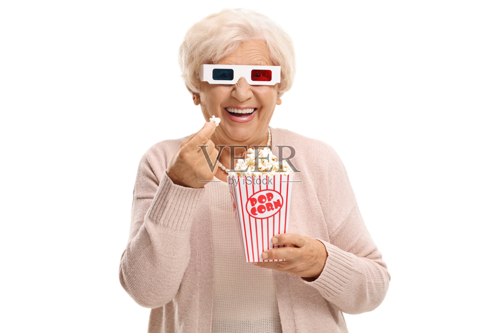 戴着3D眼镜吃爆米花的快乐成熟女人照片摄影图片