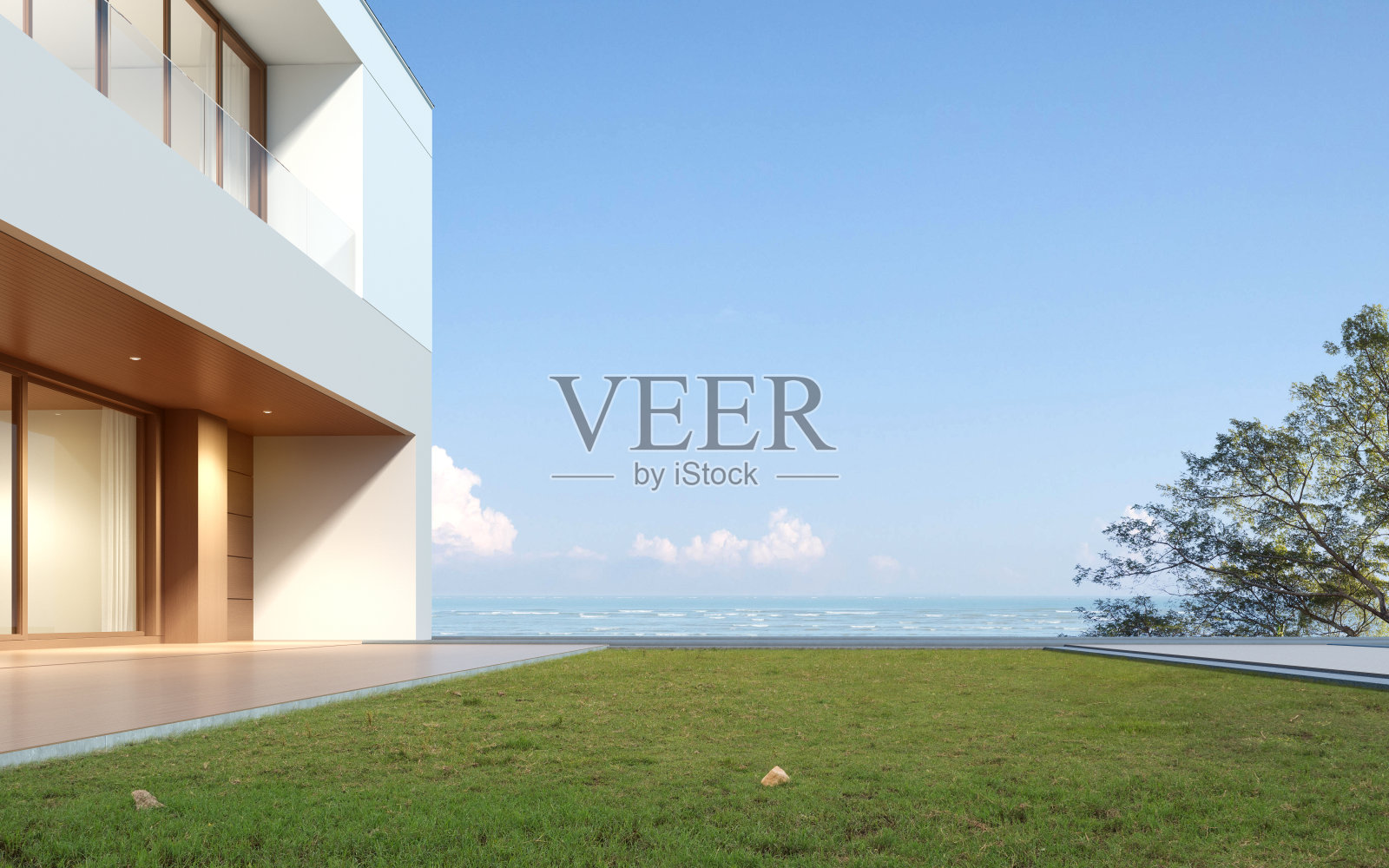 现代豪华建筑的视角，以木质露台和草地为背景的海景，双层住宅的金属屋顶设计。3 d渲染。照片摄影图片