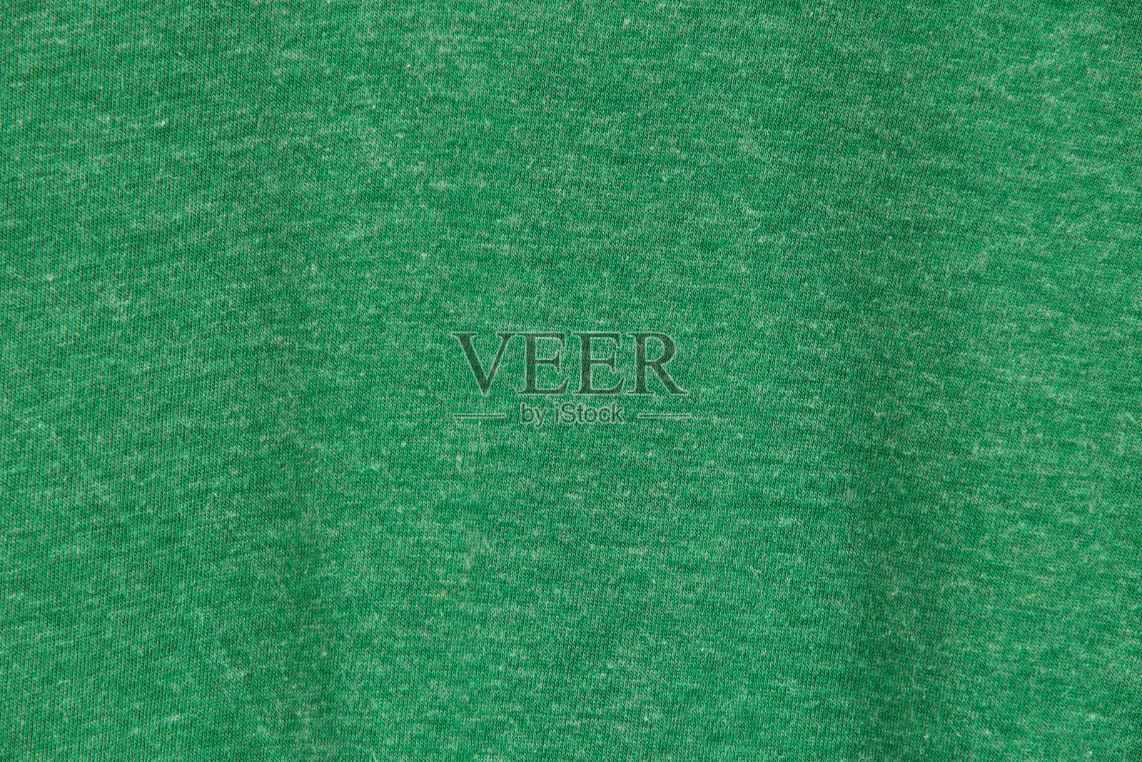 近距离观察绿色织物纹理。纺织品的背景。照片摄影图片