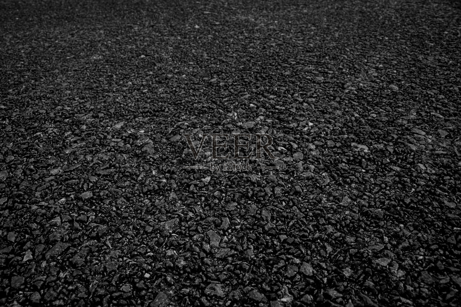 黑色沥青路面纹理背景。照片摄影图片