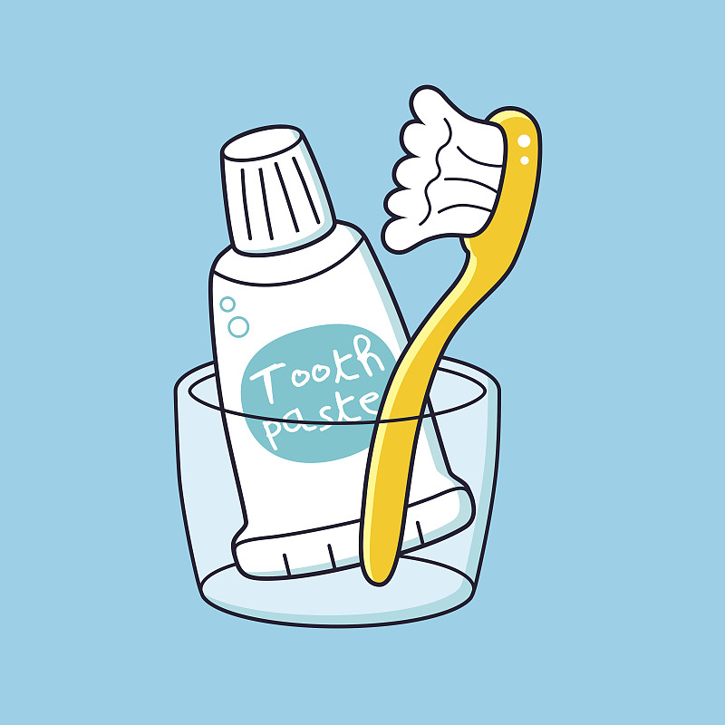 牙刷和牙膏放在杯子里。图片素材